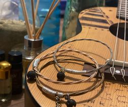 SERENITY NOW Aromatherapy Lava Rock Guitar String Bracelet